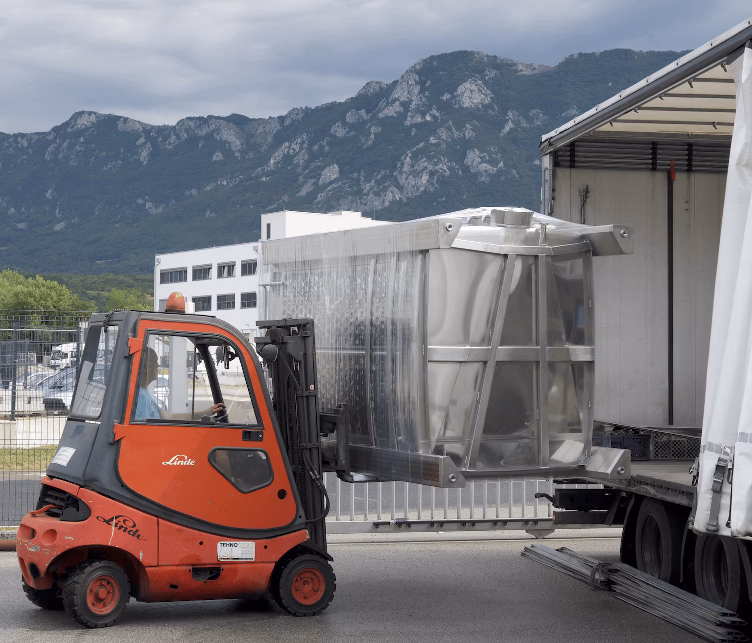 stainless steel products transportation - loading lorry with stainless steel tank