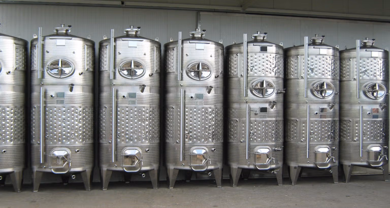 line of combination tanks with smaller capacity tanks integrated on top